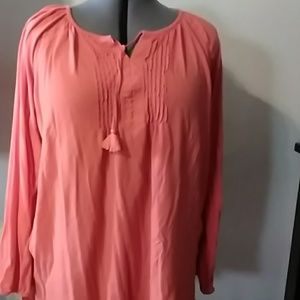 A long sleeved coral shirt